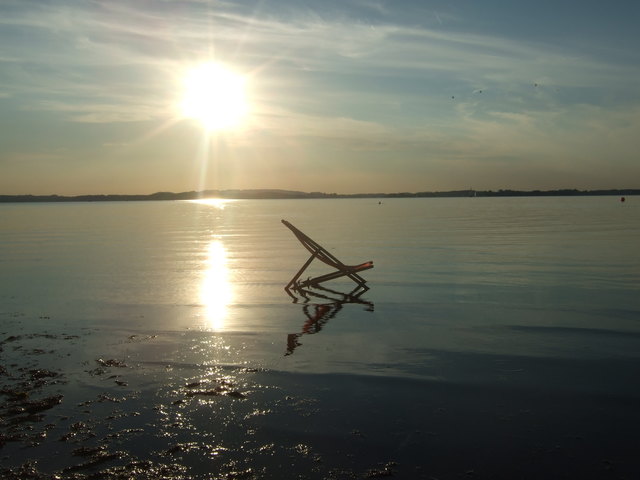 Sonnenuntergang mit Liegestuhl
