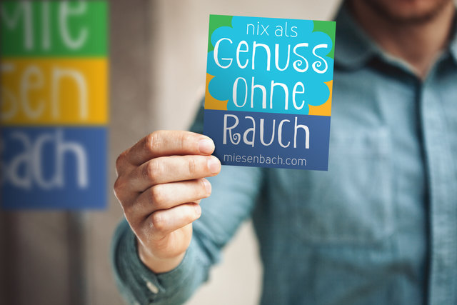 Man holding business card on blurred background