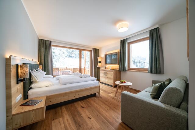 Das gemütliche Familienzimmer des Trattlerhofs lädt zum Krafttanken ein, um fit für die Piste zu sein. | Foto: Gert Perauer