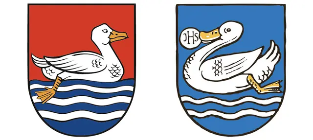 Links ist das Wappen der Gemeinde Handenberg zu sehen. Rechts befindet sich das Gemeindewappen von Auerbach. 