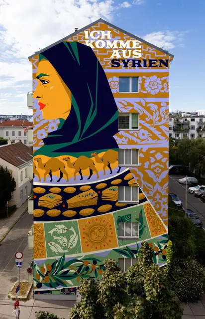 "Ich komme aus Syrien" steht auf diesem Wandbild von Aliz Buzas zu lesen. Darauf hat sie Fische, Fladenbrot und Kamele, aber auch eine Frau mit Kopftuch gemalt. | Foto: Aliz Buzas