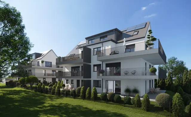 Großzügige überdachte Terrassen- und Balkonflächen fungieren als eine Art erweiterter Wohnbereich und bieten einen schönen Ausblick in die umliegende Landschaft. | Foto: Living Invest