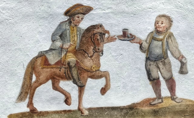 Ein Wirt reicht dem Salzhändler ein Getränk. Freskendetail am Gemeindeamt Pettnau. ©W. Kräutler
